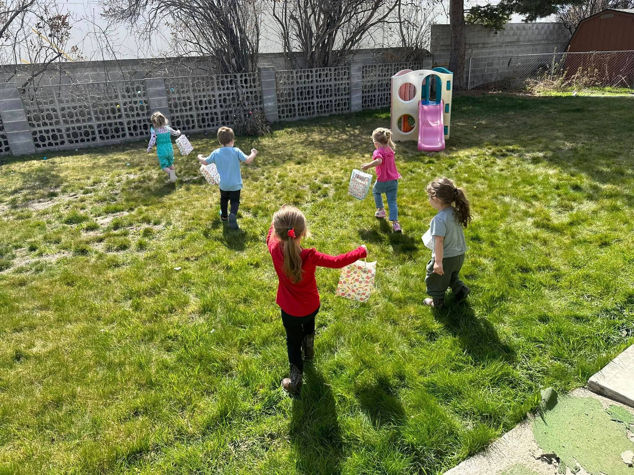 Children enjoying outdoor play at a licensed childcare facility in Filer, ID