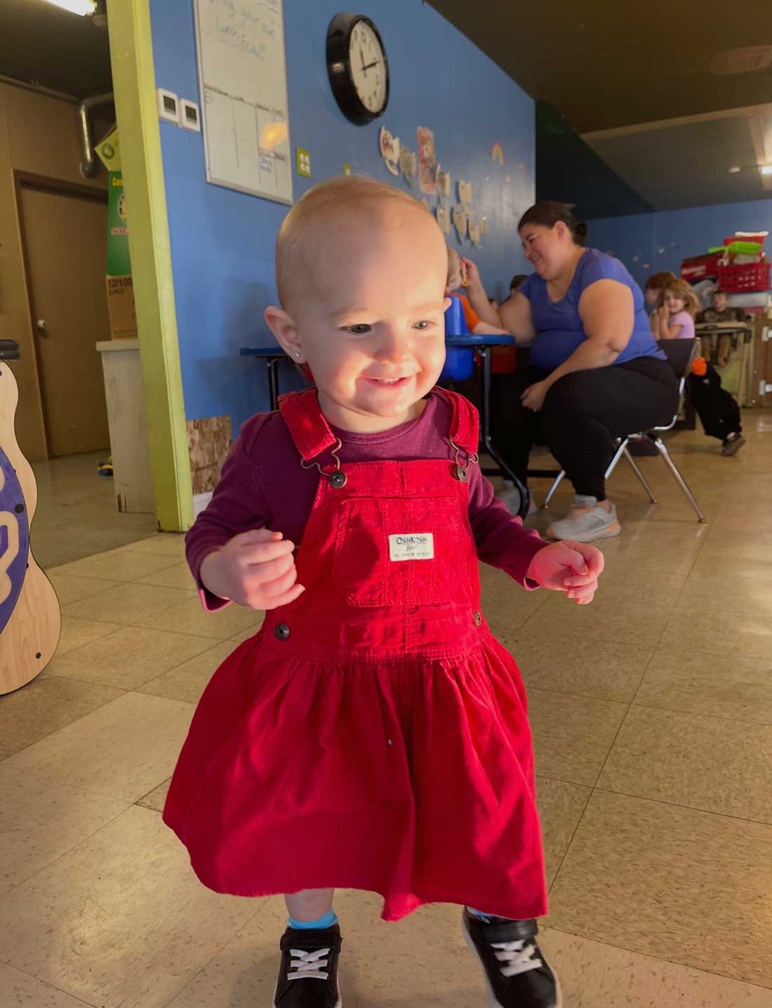 Infant standing in a nurturing infant care services program in Filer, ID