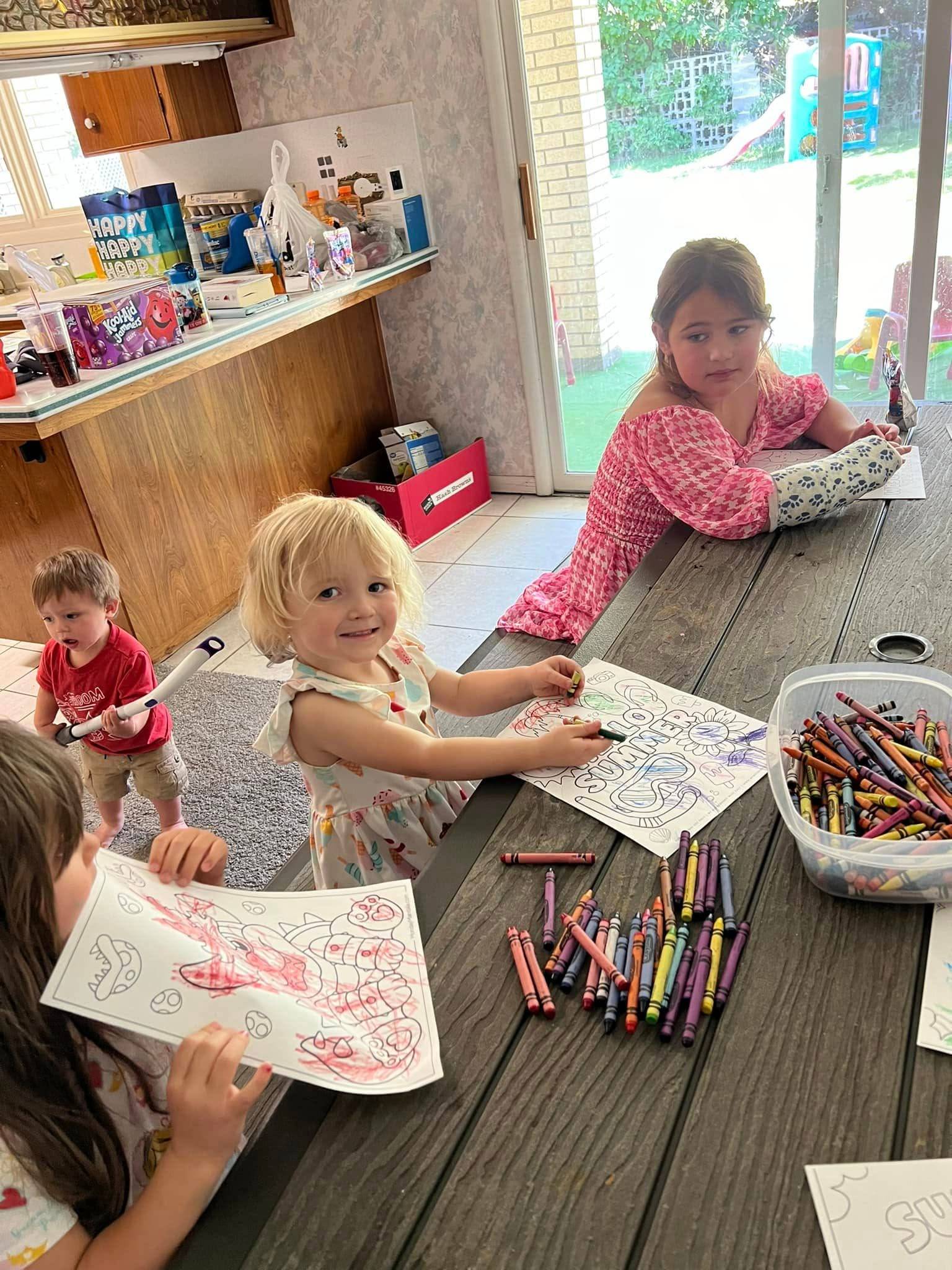 Kids enjoying a coloring activity during full-time childcare in Twin Falls, ID