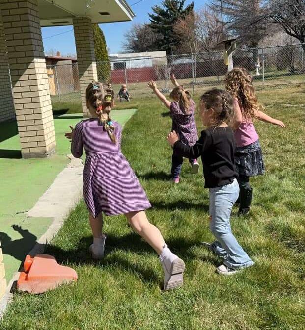 Children playing outdoors at Filer daycare on US-30, encouraging active play in a safe childcare environment
