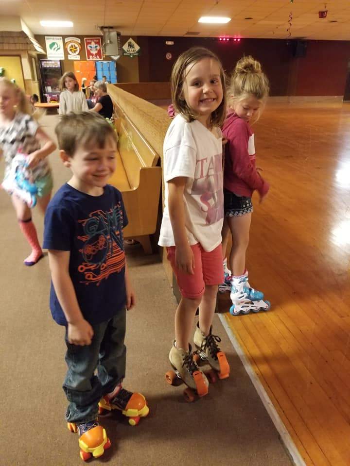 Kids rollerblading during enrichment activities at a full-time childcare program